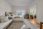 Kansas City apartment for rent - A bedroom with a large bed and a couch.