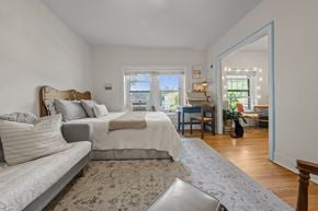 Kansas City apartment for rent - A bedroom with a large bed and a couch.