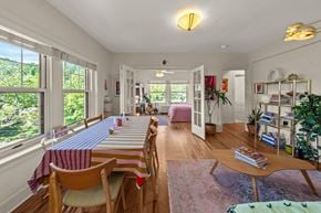 Kansas City apartment for rent - A dining room with a long table and chairs.