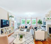 Kansas City apartment for rent - A living room with a fireplace and a couch.