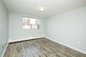 Oshawa apartment for rent - A room with a window and a radiator on the floor.