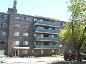 Oshawa apartment for rent - an apartment building with a red truck parked in front of it