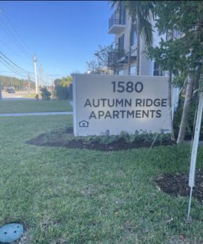 West Palm Beach apartment for rent - A sign for Autumn Ridge Apartments is in the foreground.