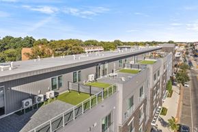 Ferndale apartment for rent - an aerial view of a large building with a roof terrace and green grass