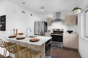 Ferndale apartment for rent - a kitchen with stainless steel appliances and a marble counter top