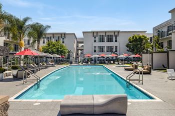 Olympic-size heated pool & spa with cabanas and sundeck lounge areas