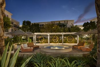 Resort-style courtyard with custom water feature and pergola