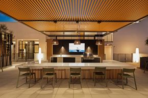 Los Angeles apartment for rent - A modern outdoor dining area with a long table and chairs.