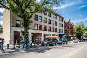 Evanston apartment for rent - A street view of a building with a bicycle rack in front of it.