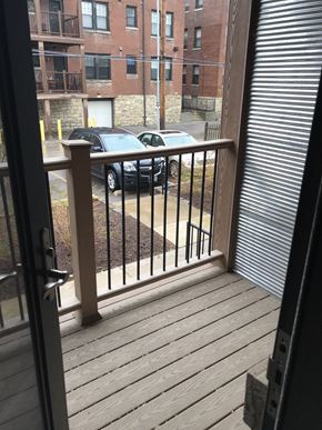 Saint Louis apartment for rent - a balcony with a view of a parking lot