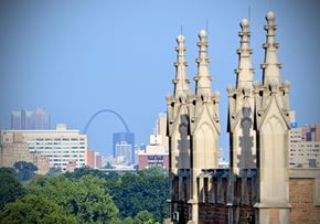 St. Louis apartment for rent - A cityscape with a large arch in the background and a building in the foreground.