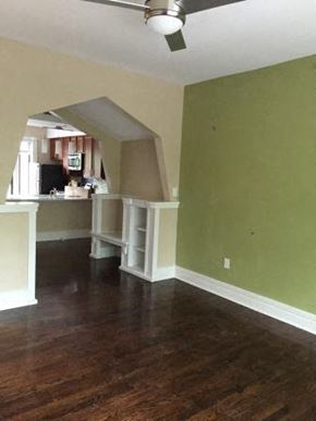 Saint Louis apartment for rent - an empty living room and kitchen with a wood floor