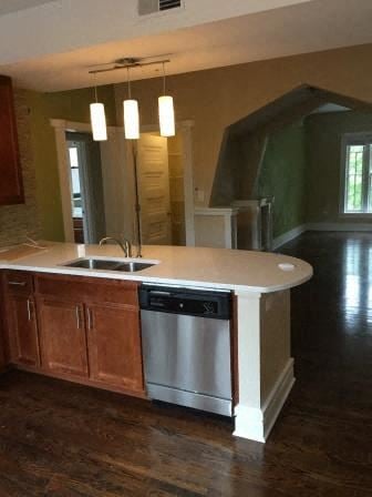 Saint Louis apartment for rent - an empty kitchen with a sink and a dishwasher