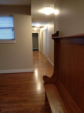 St. Louis apartment for rent - a hallway with a wood floor and a staircase