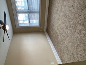 St. Louis apartment for rent - an empty room with a window and a fan