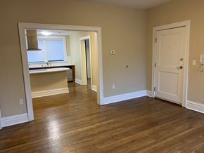 St. Louis apartment for rent - a living room and a kitchen with a wooden floor