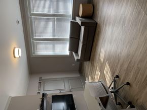 University apartment for rent - a small office with a desk and a window