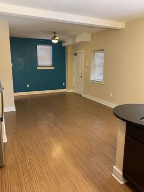 Saint Louis apartment for rent - an empty living room with wood floors and a blue wall