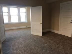 St. Louis apartment for rent - an empty room with a white door and a window