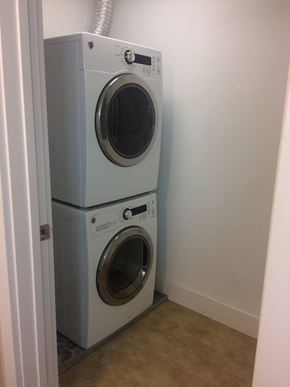 University City apartment for rent - a front load washer and dryer in a laundry room