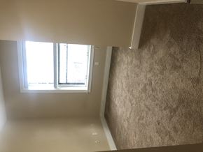Saint Louis apartment for rent - a room with a window on the wall and a staircase