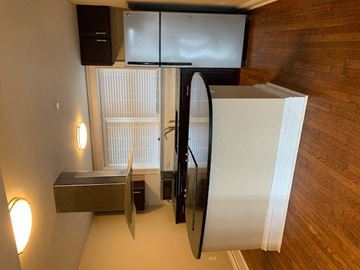 St. Louis apartment for rent - a kitchen with a refrigerator and a mirror