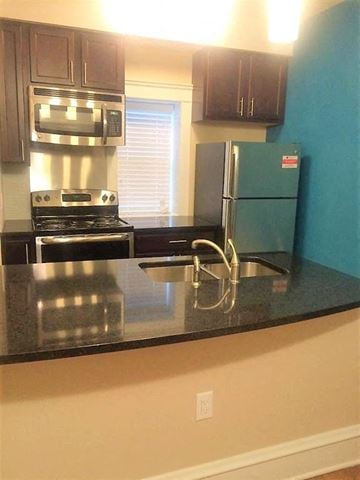 Saint Louis apartment for rent - a kitchen with a stove and a refrigerator