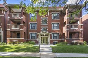 Saint Louis apartment for rent - a red brick apartment building with stairs and a sidewalk