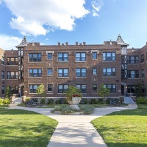 Saint Louis apartment for rent - A large brick building with a courtyard in front.