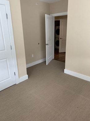 Saint Louis apartment for rent - an empty room with a door open to a hallway