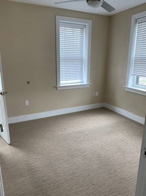 Saint Louis apartment for rent - an empty room with two windows and a door