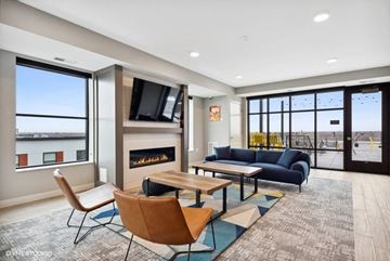 Minneapolis apartment for rent - a living room with a fireplace and a television