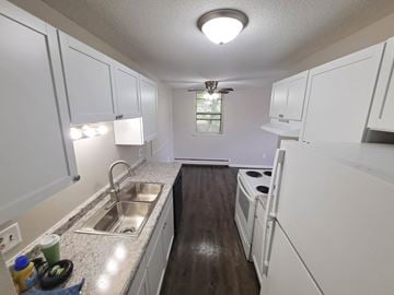 St. Paul apartment for rent - A kitchen with white cabinets and a sink.