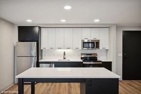 St. Paul apartment for rent - Harbourline Apartments, St Paul a kitchen with white cabinets and stainless steel appliances