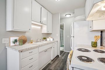 White Bear Lake apartment for rent - A white kitchen with a stove top oven.