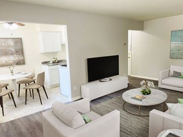 West St. Paul apartment for rent - a living room with couches and a table and a television