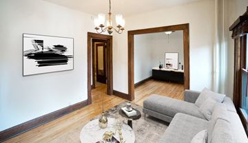 Minneapolis apartment for rent - a living room with a couch and a table and a mirror
