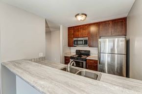 St. Paul apartment for rent - a kitchen with stainless steel appliances and a counter top