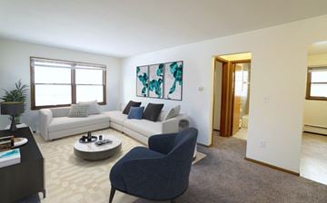 St. Paul apartment for rent - a living room with a couch and a chair and a table