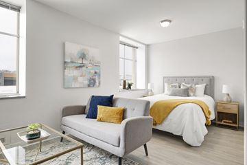 Falcon Heights apartment for rent - a living room with a couch and a bed