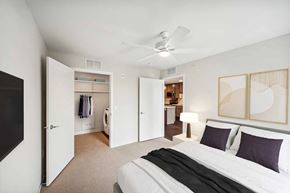 Cambridge apartment for rent - a bedroom with a bed and a ceiling fan