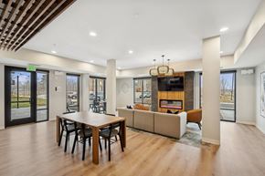 Brooklyn Center apartment for rent - Wangstad Commons, Brooklyn Center,  A modern dining room with a wooden table and chairs.