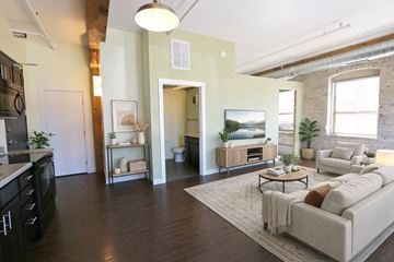 Minneapolis apartment for rent - A modern living room with a grey sofa and a coffee table.