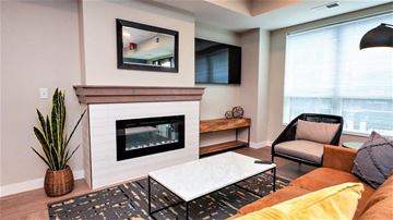 Bloomington apartment for rent - a living room with a fireplace and a couch