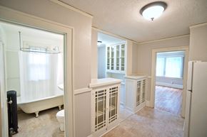 St Paul apartment for rent - A white bathroom with a toilet, sink, and bathtub.