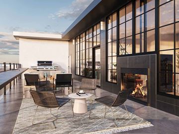 Minneapolis apartment for rent - a living room with a fireplace and a table and chairs