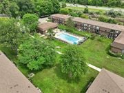 Harrison Township apartment for rent - Expansive green space and heated pool at Drawbridge Apartments in Harrison Township, MI.