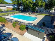Clinton Township apartment for rent - Open and heated pool space with lounge chairs and 24/7 secured package lockers at Knottingham Apartments in Clinton Township, MI