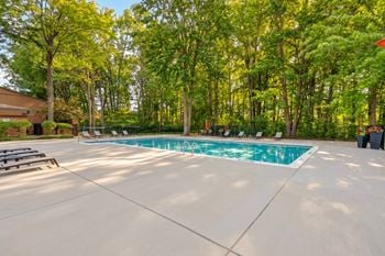 Heated swimming pool and sundeck at eastwood village apartments in clinton township, mi.