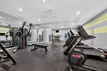 24-Hour fitness center and sauna at eastwood village apartments in clinton township, mi.